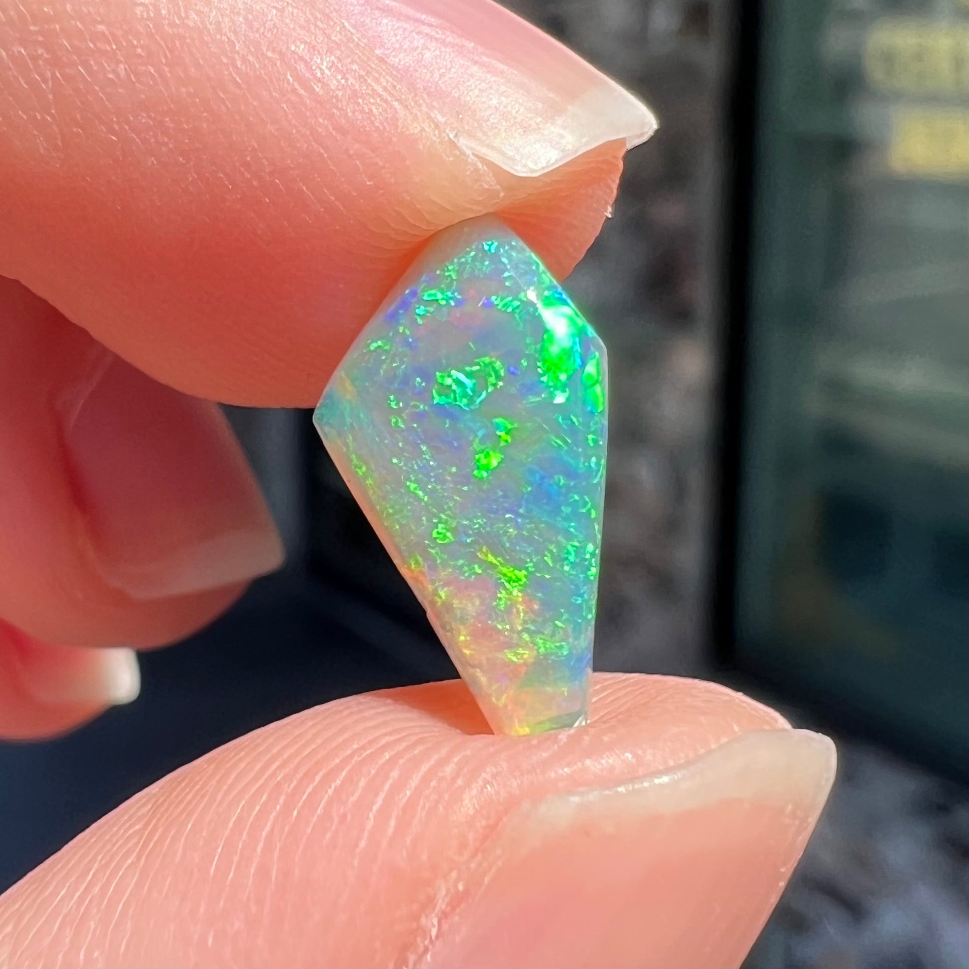 A loose, 1.27 carat Lightning Ridge crystal opal.  The opal has green colors.