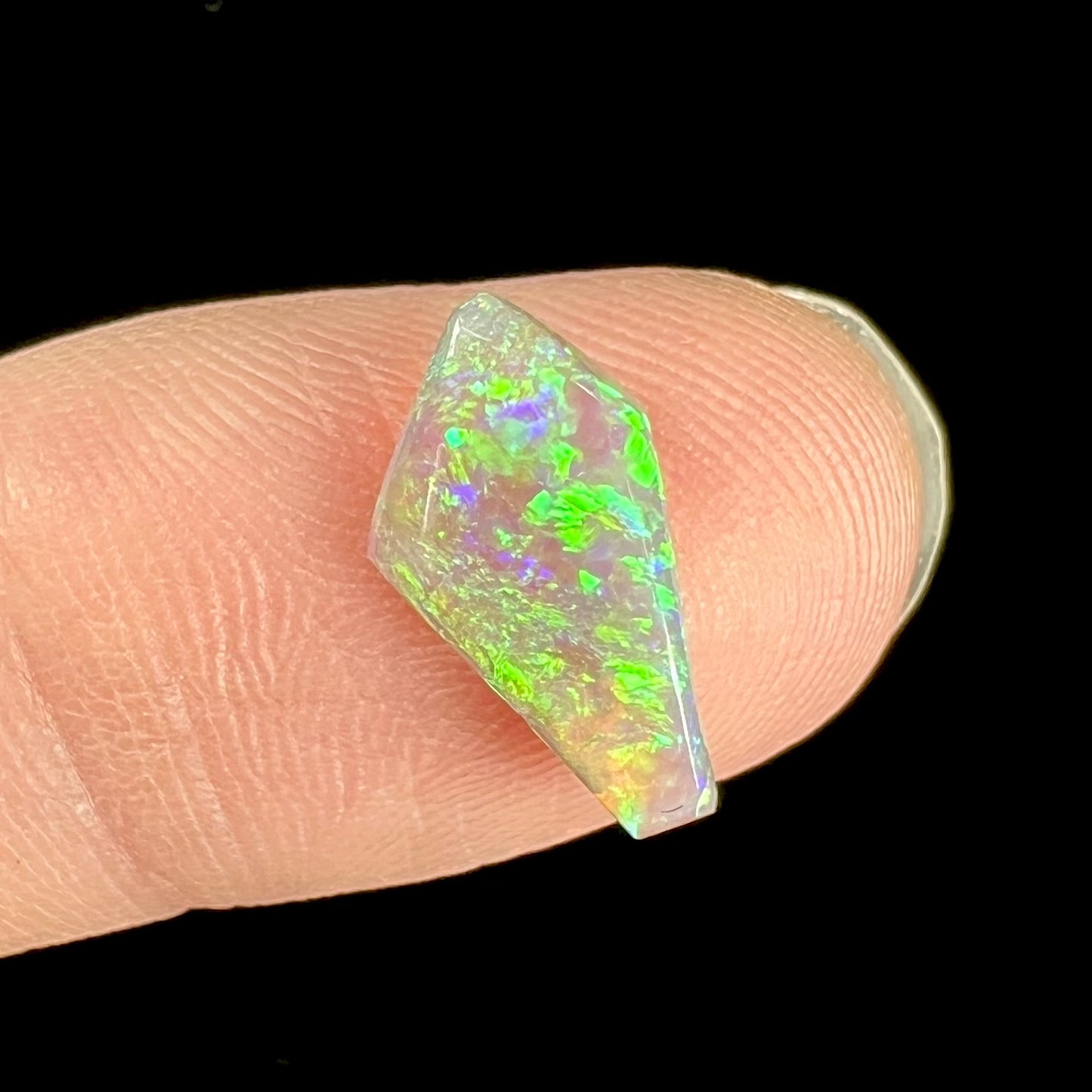 A loose, 1.27 carat Lightning Ridge crystal opal.  The opal has green colors.