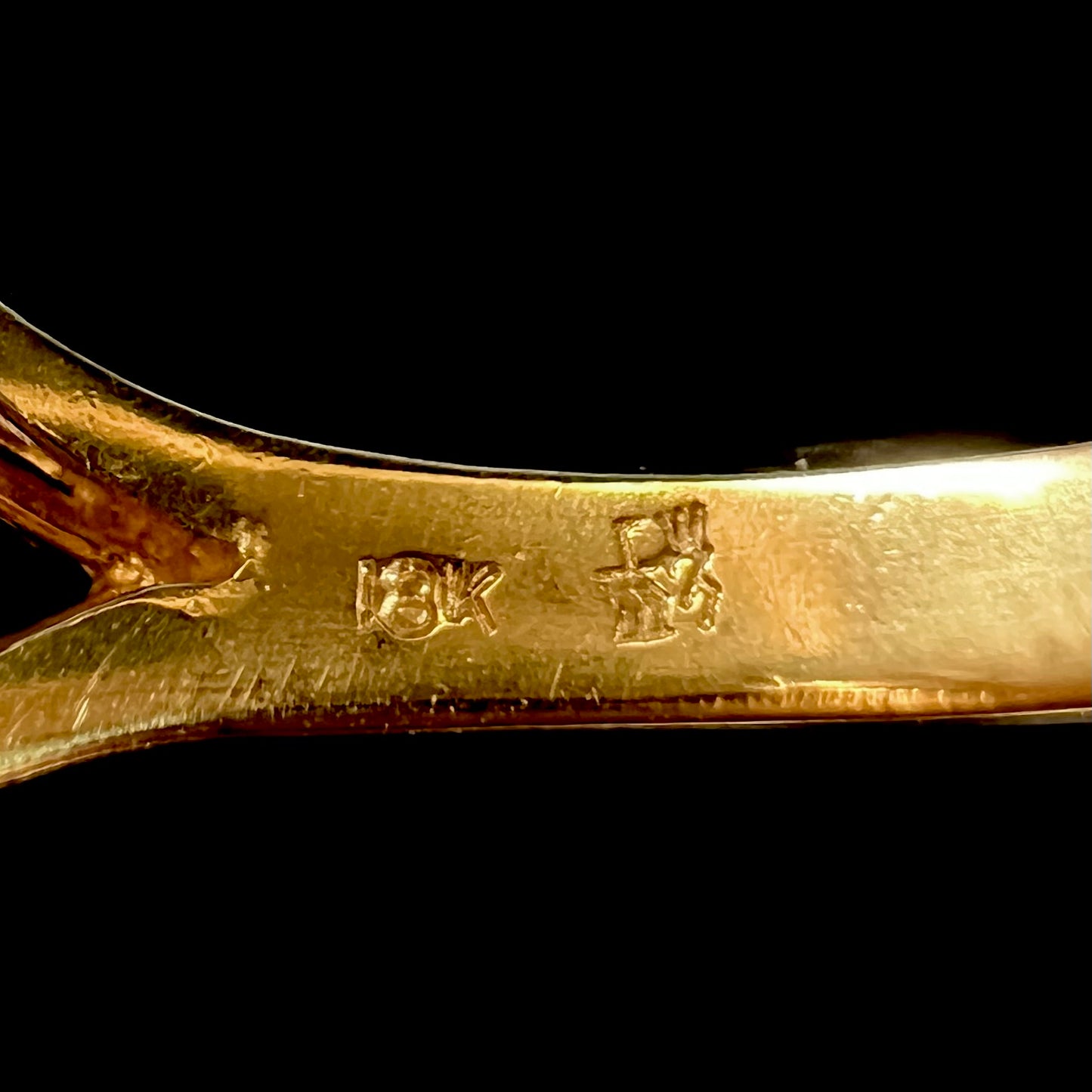 18k gold stamp on a ring's shank.