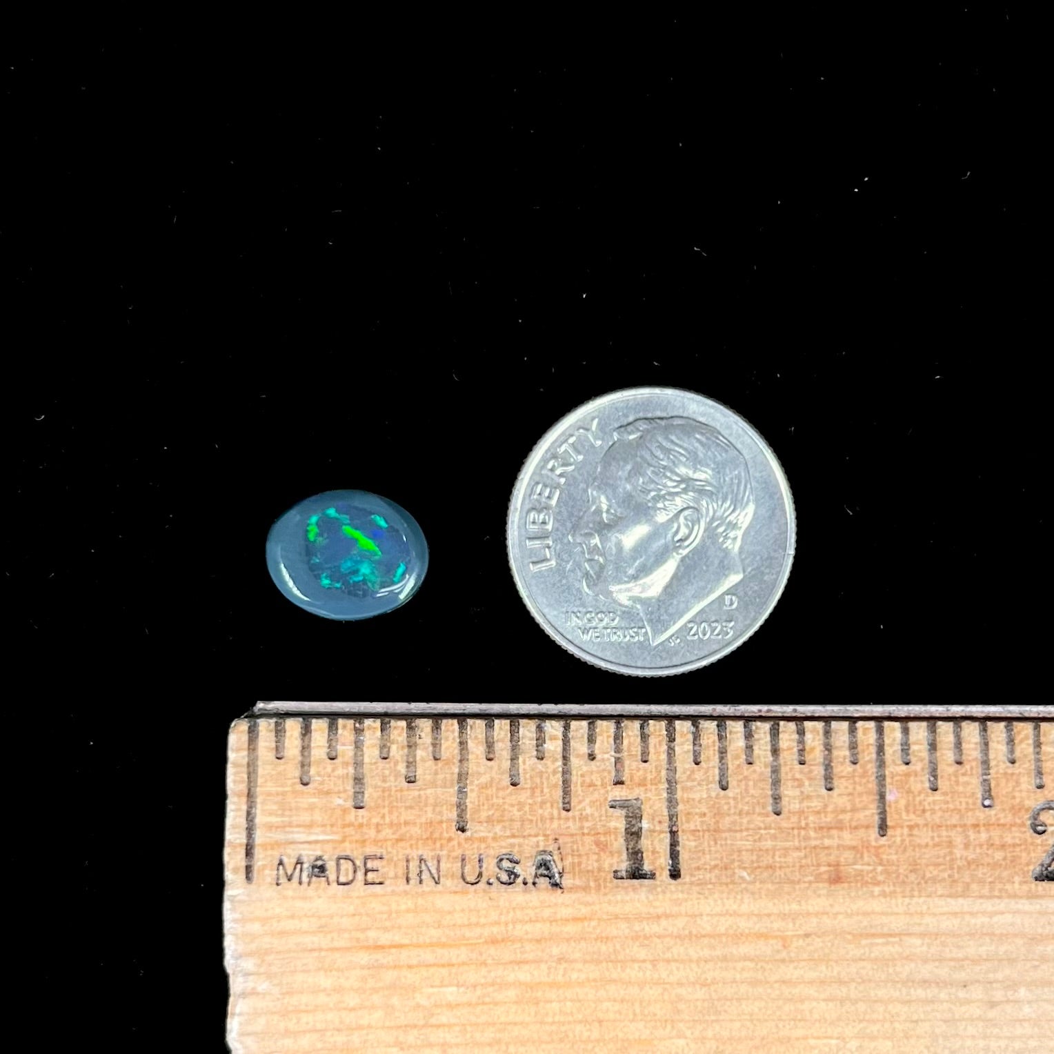 A 2.68 carat loose, oval cabochon cut black opal stone from Lightning Ridge, Australia.  The opal has a N2 body tone.