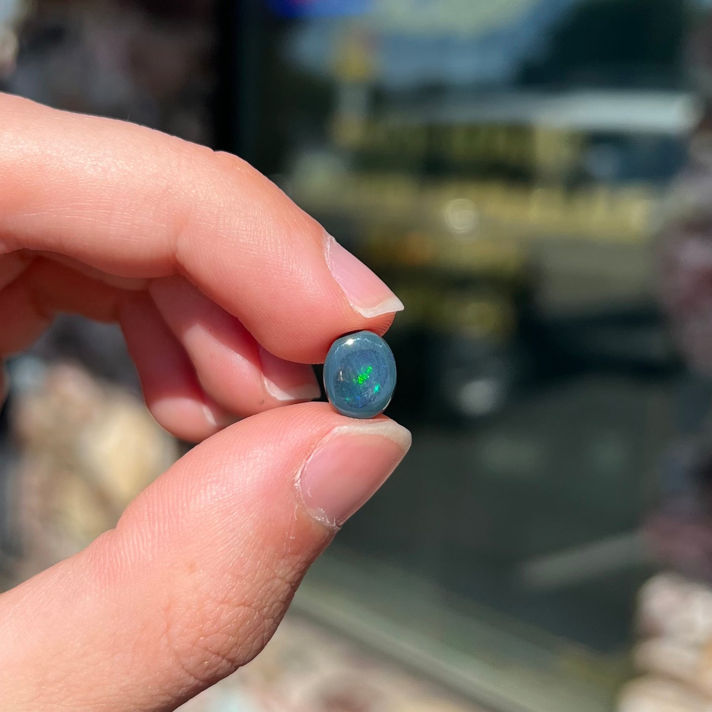 A 2.68 carat loose, oval cabochon cut black opal stone from Lightning Ridge, Australia.  The opal has a N2 body tone.