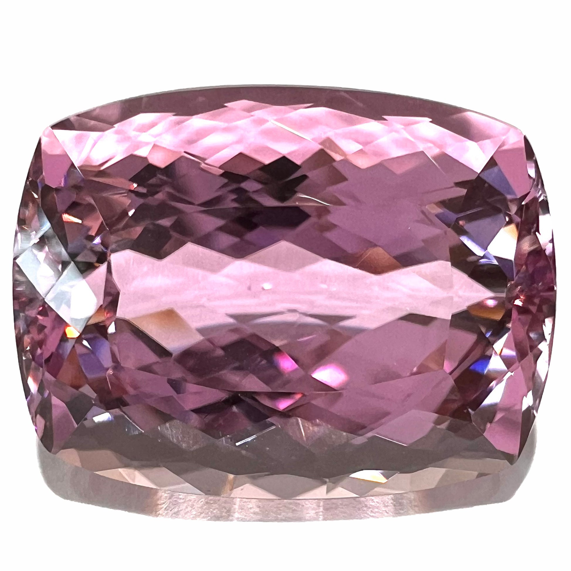 A modified cushion cut Afghanistan kunzite gemstone.  The stone is a purplish pink color and weighs 49.30 carats.