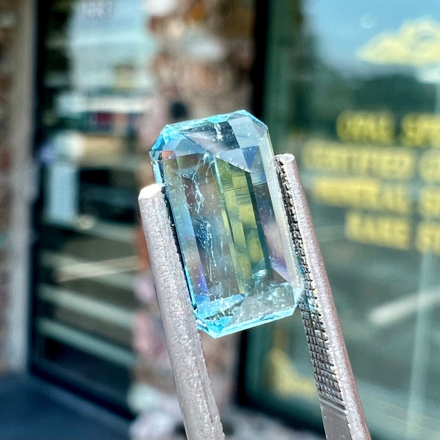 A loose, faceted emerald cut aquamarine stone.  The stone is icy blue in color, indicative of Vietnamese origin.