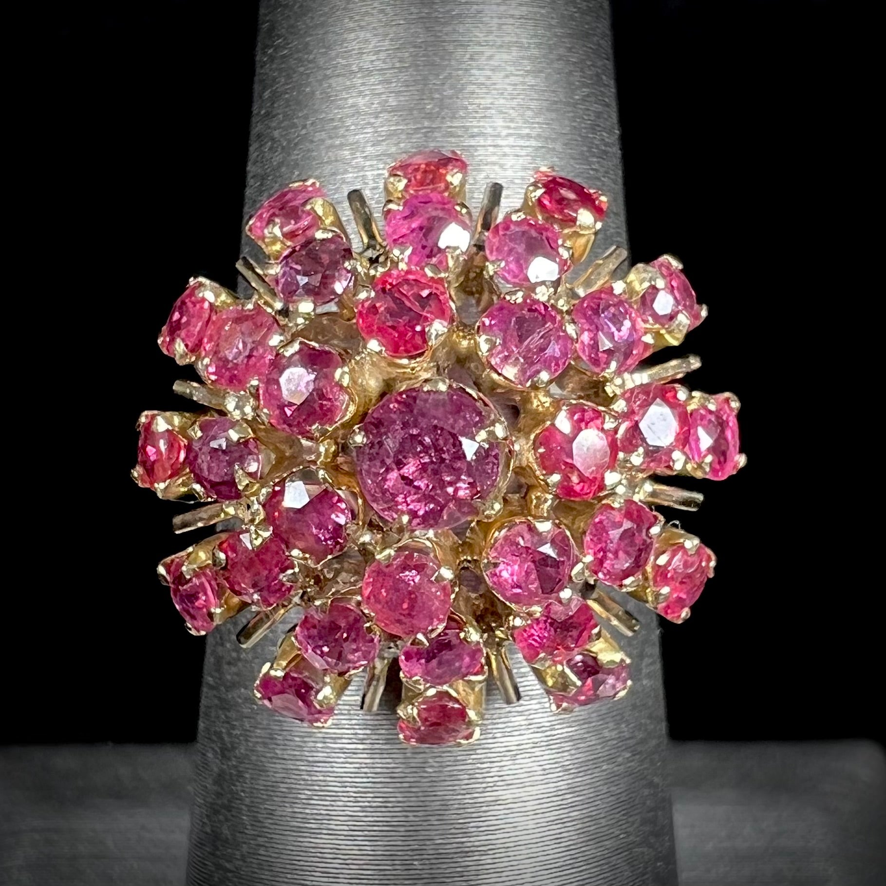 A ladies' vintage Thai princess ring set with round cut purplish red rubies.