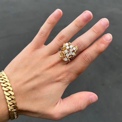 A ladies' 1950's style yellow gold and diamond cluster ring.  The ring is shaped like a leaf with 10 round diamonds set in it.