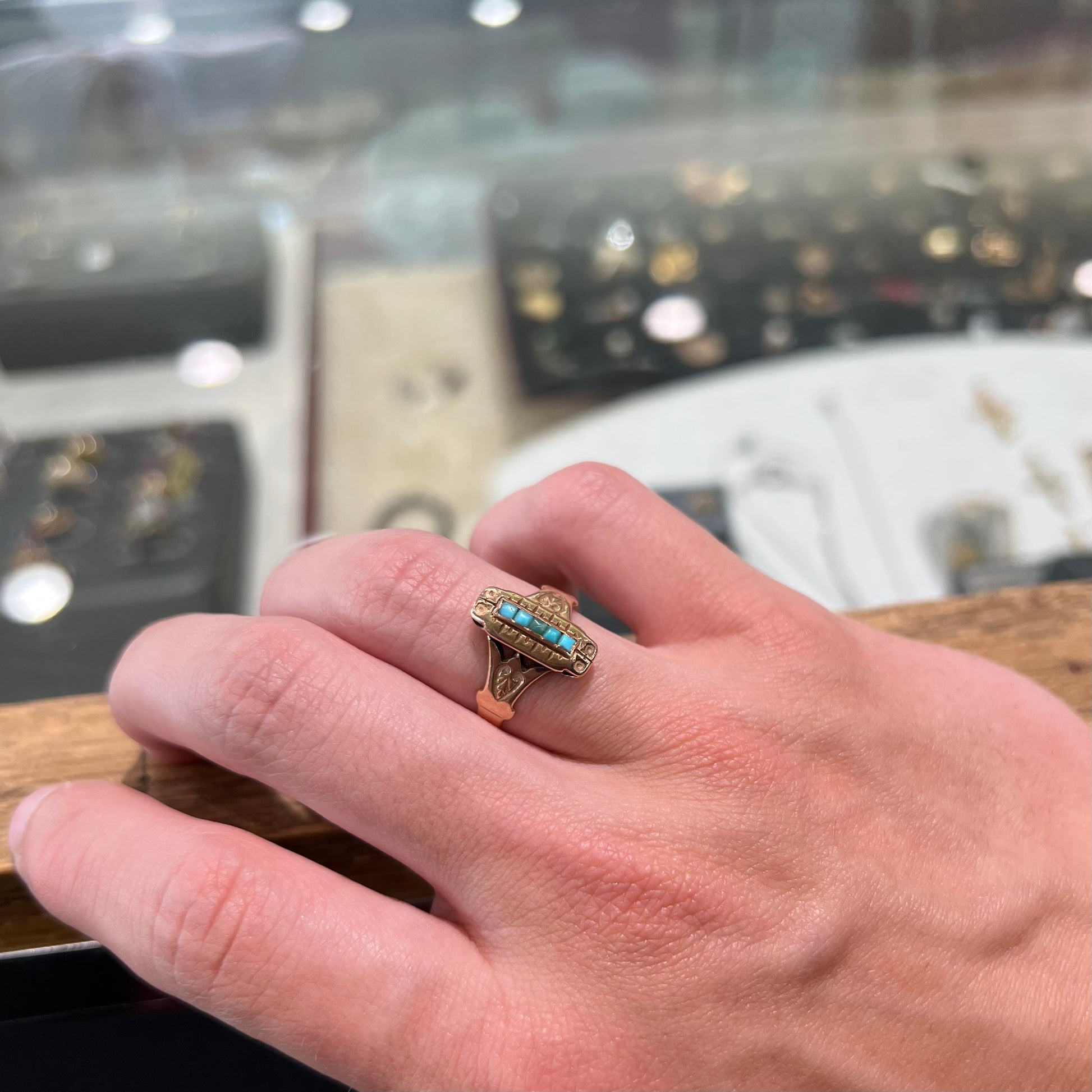 Antique yellow gold ring set with five square turquoise stones, circa 1920's.