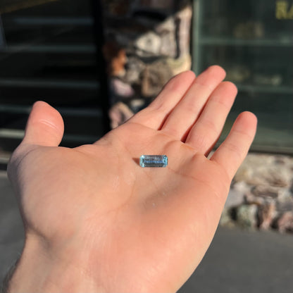 A loose, emerald cut aquamarine stone from Vietnam.  The stone is an ice blue color.