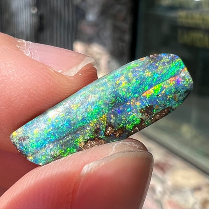 A loose, vivid boulder opal stone from Quilpie, Australia.