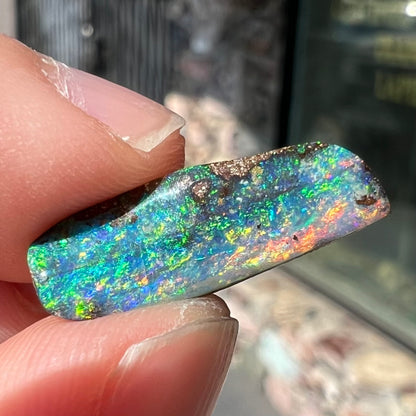 A loose, vivid boulder opal stone from Quilpie, Australia.