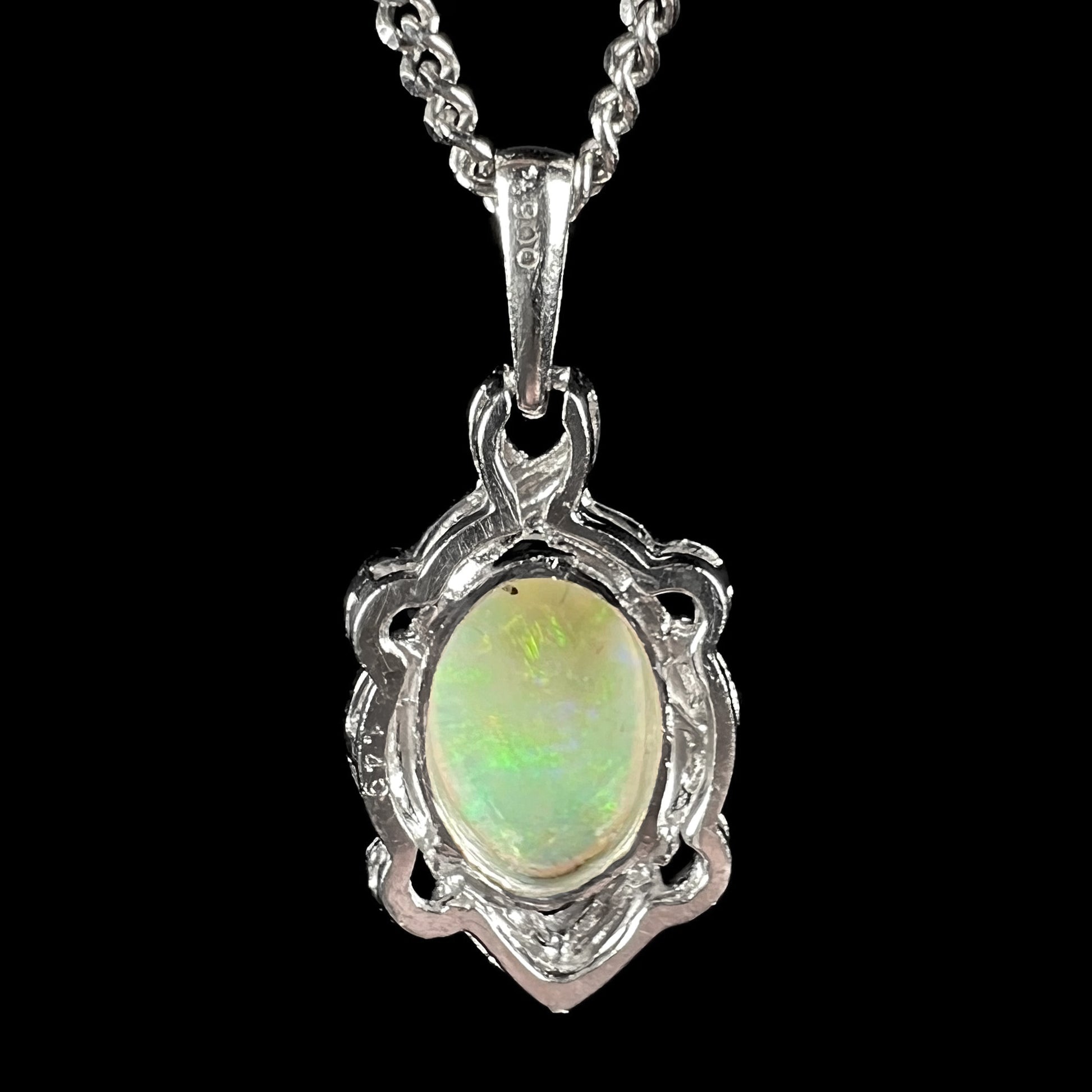 A platinum opal necklace on a platinum chain.  The opal weighs 1.49ct and has predominantly green color play.