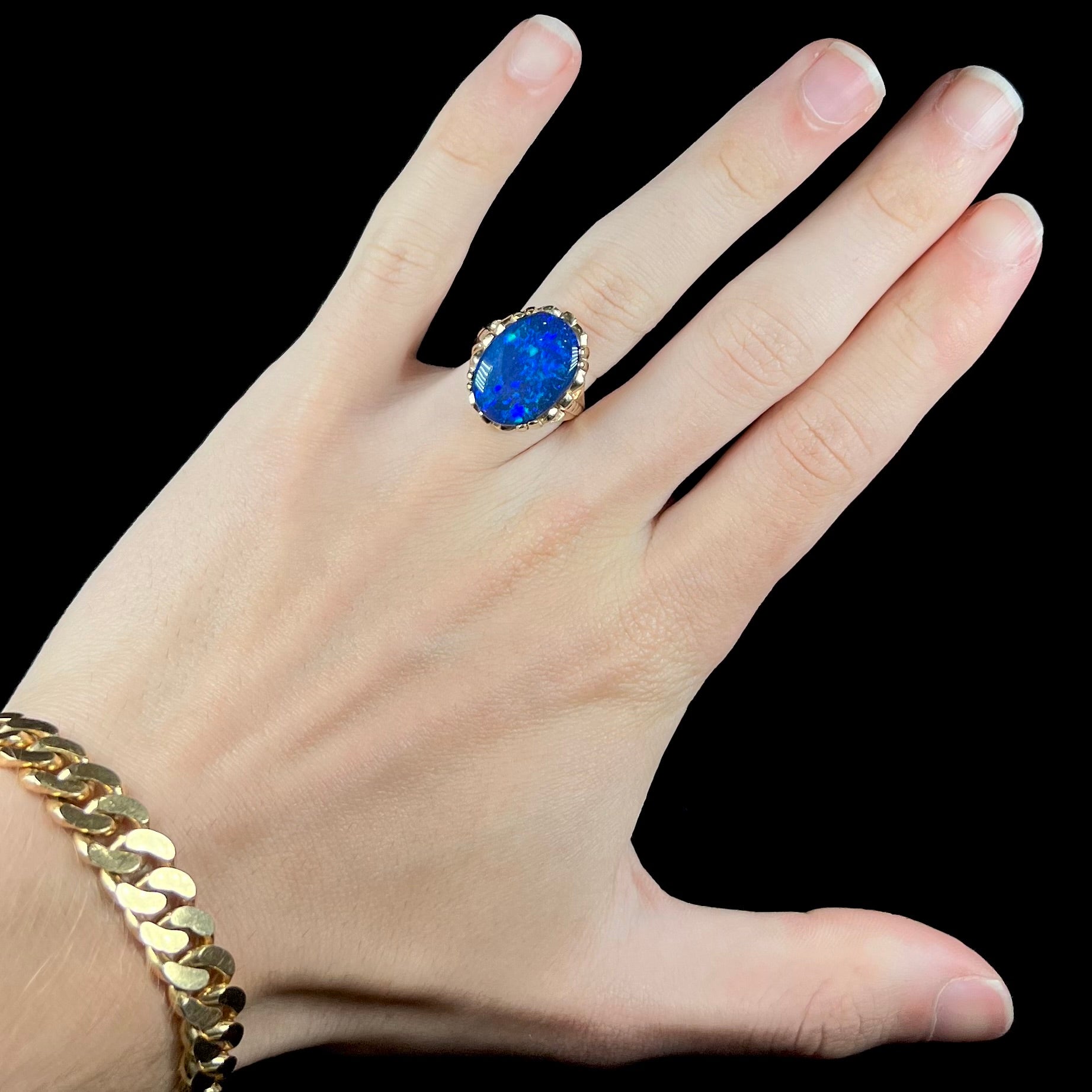 A ladies' vintage, 1940's style black opal doublet ring in yellow gold.