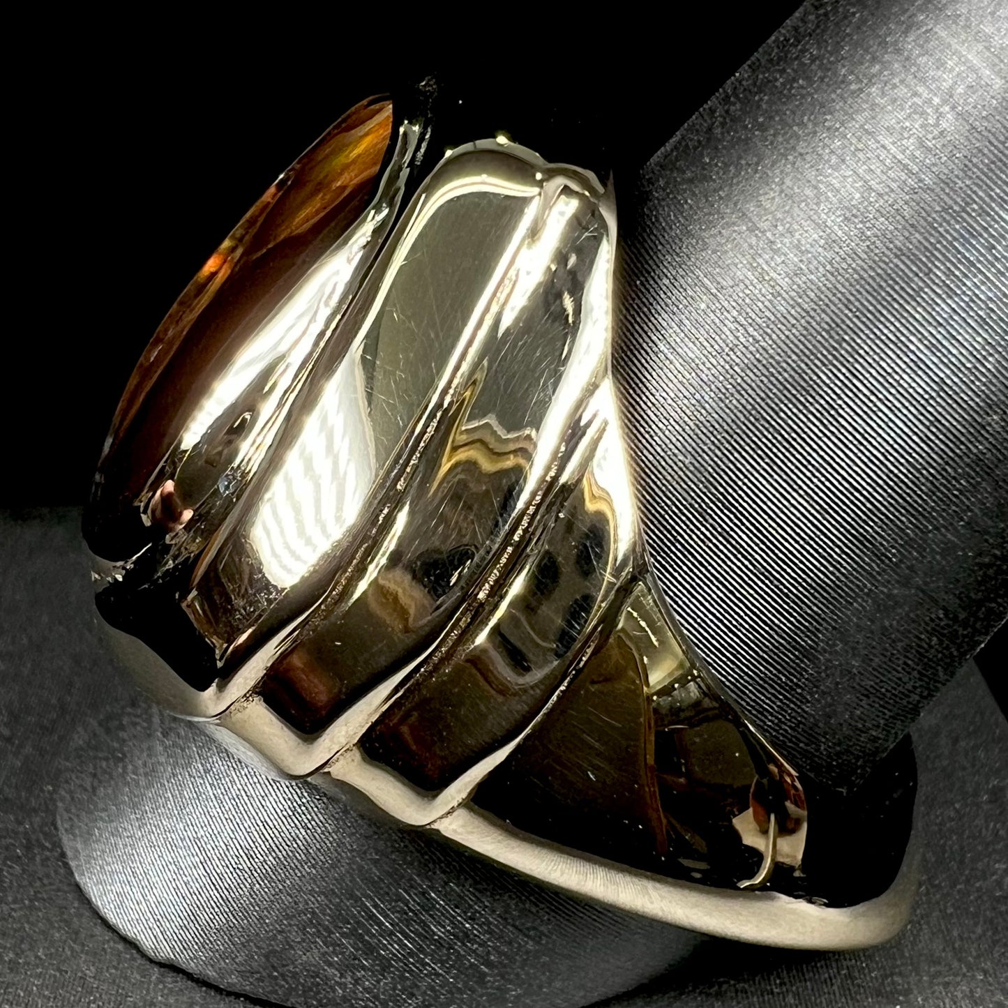 A custom, solid yellow gold men's ring with a European shank.