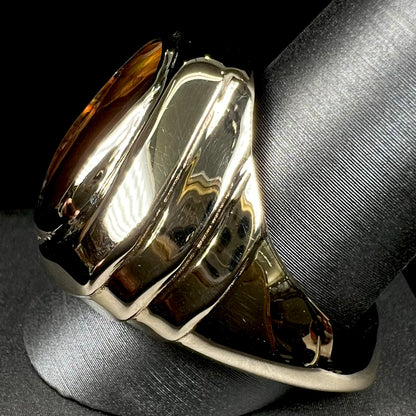 A custom, solid yellow gold men's ring with a European shank.