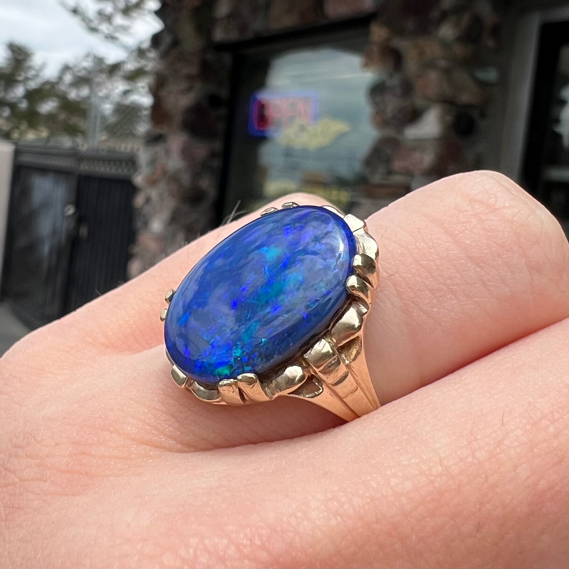 A ladies' vintage, 1940's style black opal doublet ring in yellow gold.