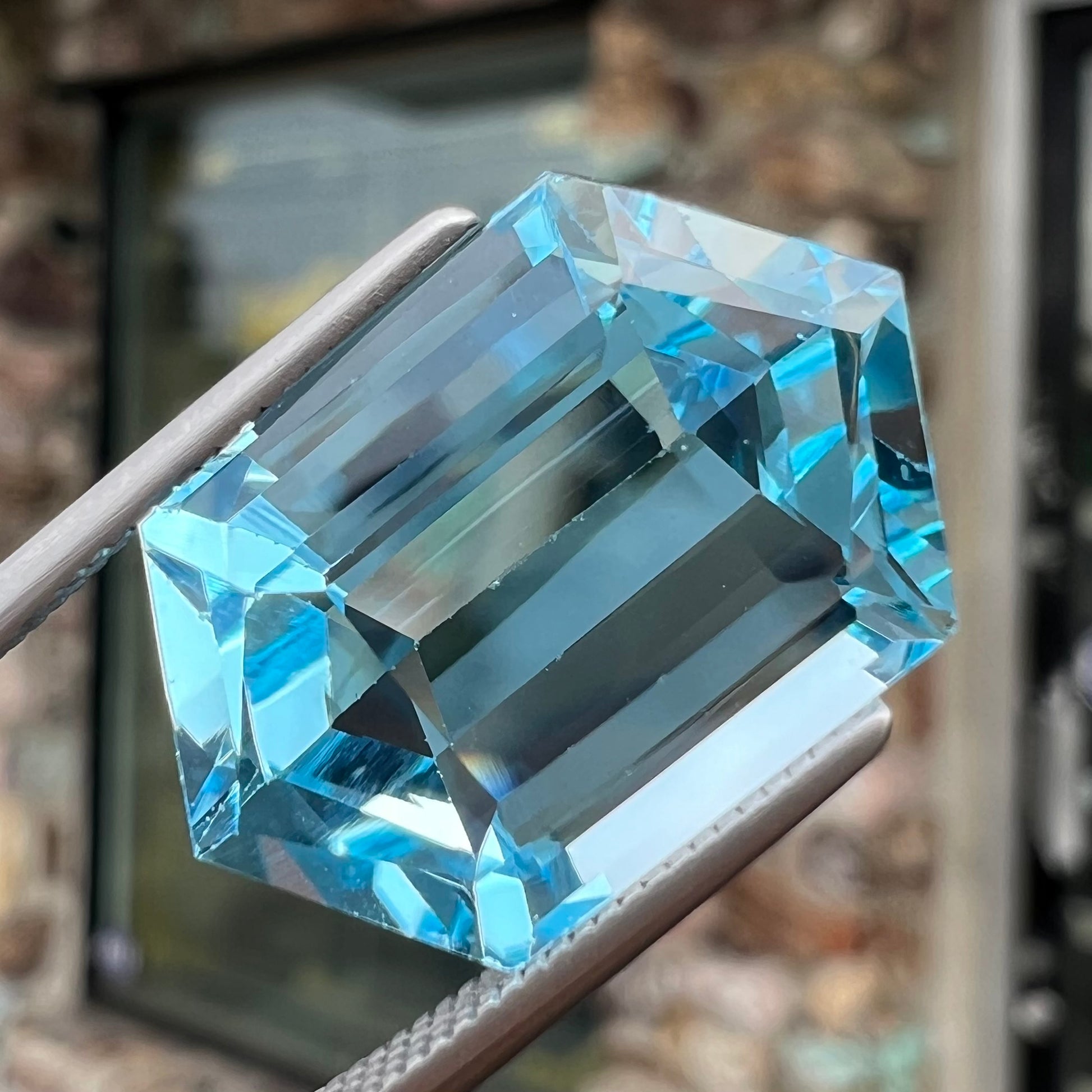 A loose, dutchess cut blue topaz gemstone.  The stone is a sky blue color.