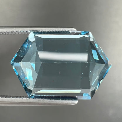 A loose, dutchess cut blue topaz gemstone.  The stone is a sky blue color.