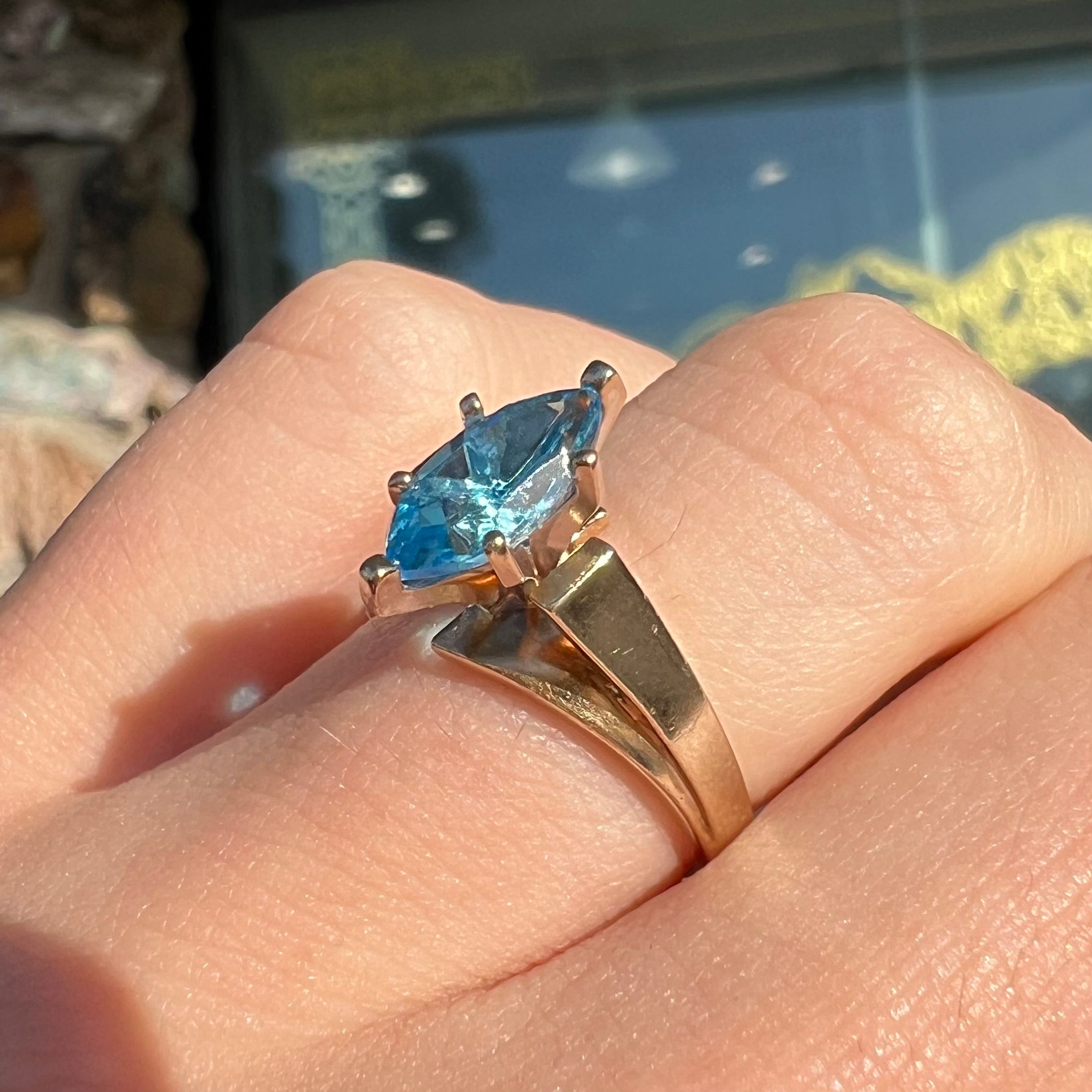 10K Yellow Gold with Blue Topaz color stone and surround crystals sold Ring size 10