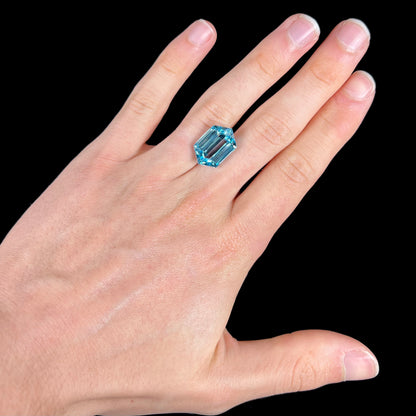 A loose, dutchess cut blue topaz gemstone.  The stone is a sky blue color.