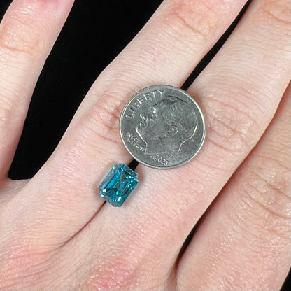 A natural blue zircon gemstone.  The stone is emerald cut.