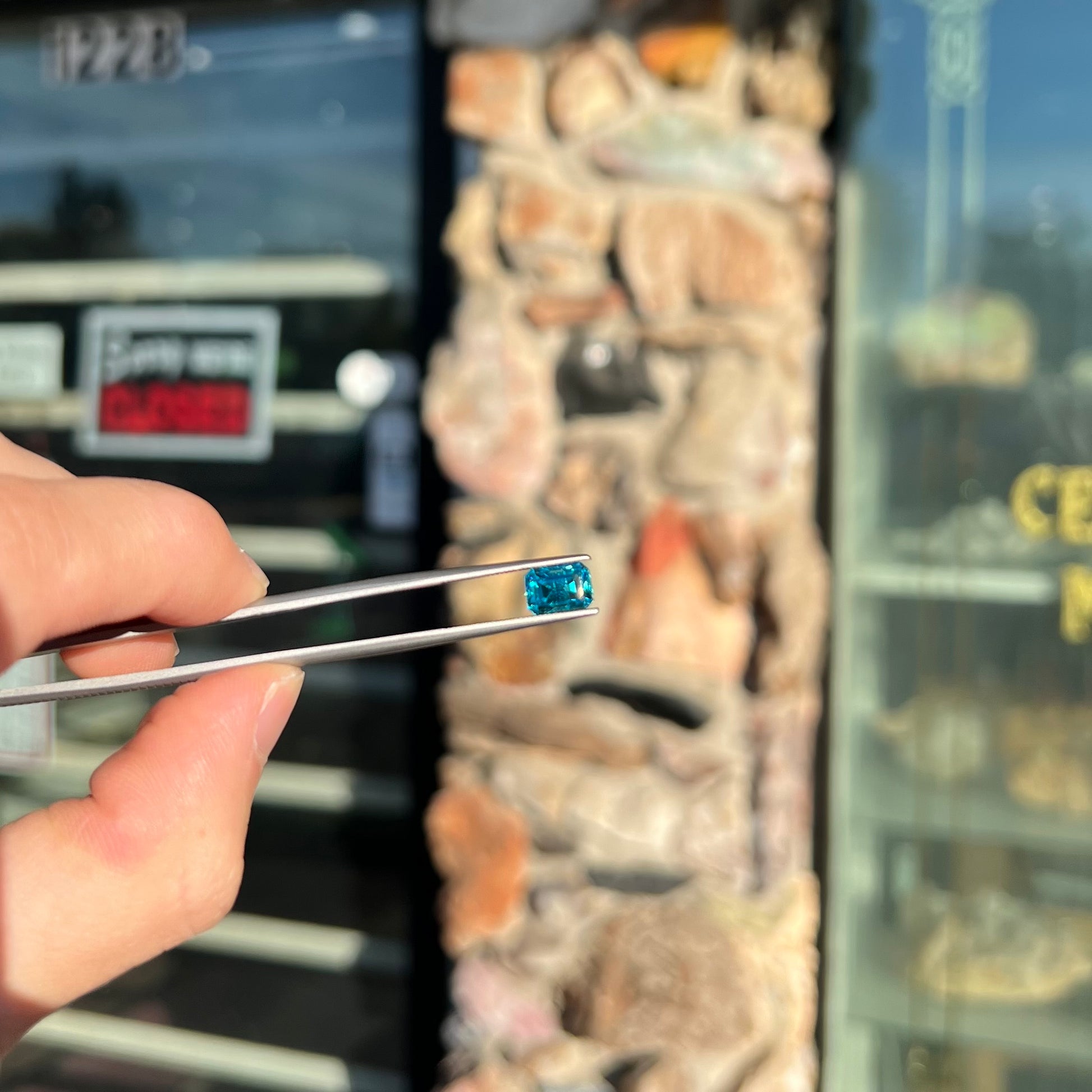 A natural blue zircon gemstone.  The stone is emerald cut.