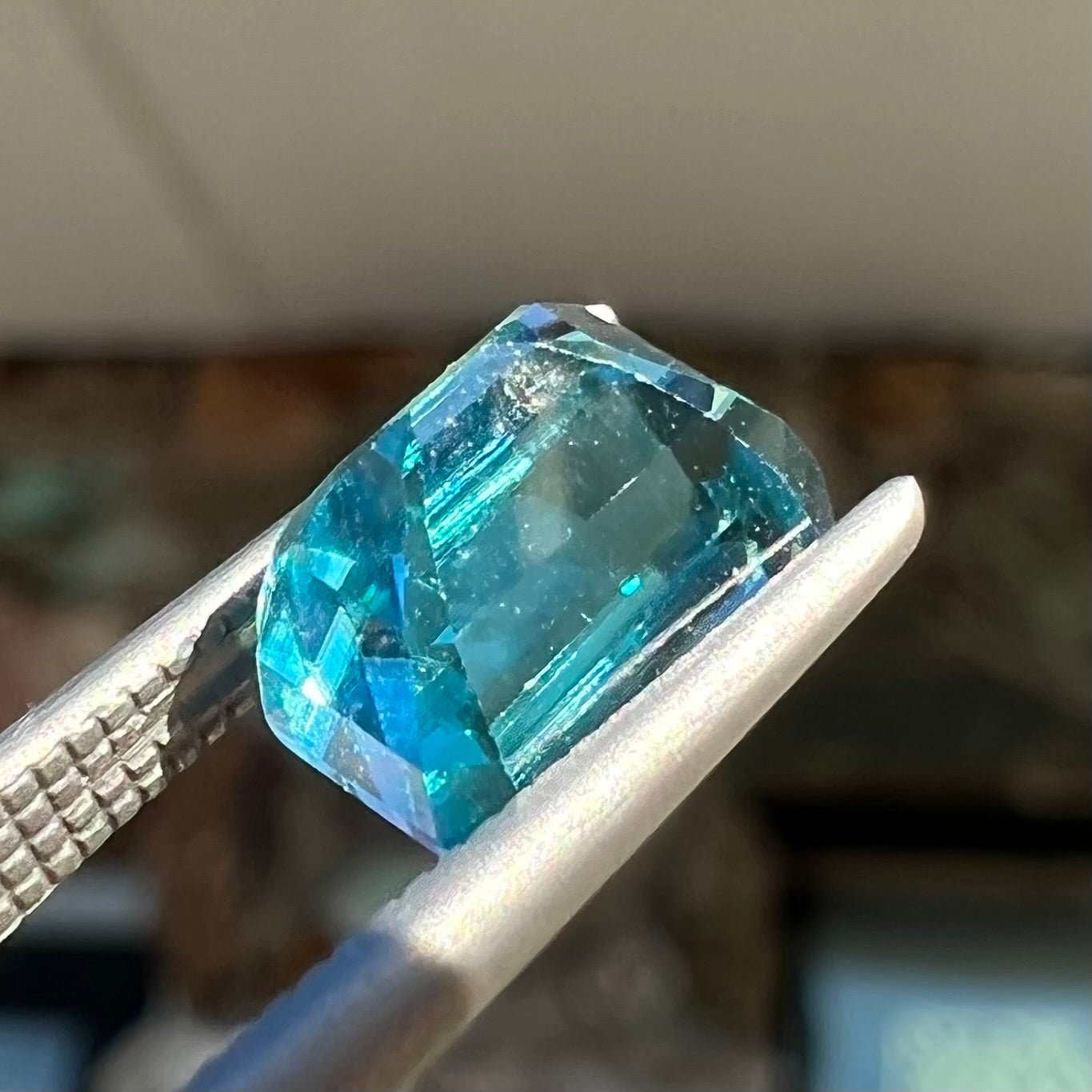 A natural blue zircon gemstone.  The stone is emerald cut.