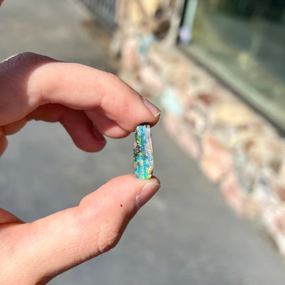 A loose, vivid boulder opal stone from Quilpie, Australia.