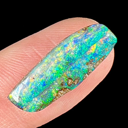 A loose, vivid boulder opal stone from Quilpie, Australia.