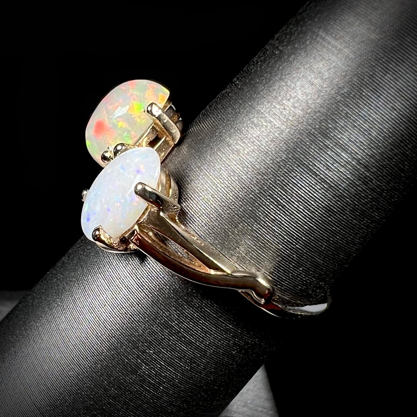 A yellow gold ring mounted with an Ethiopian fire opal and a Coober Pedy, Australian opal.