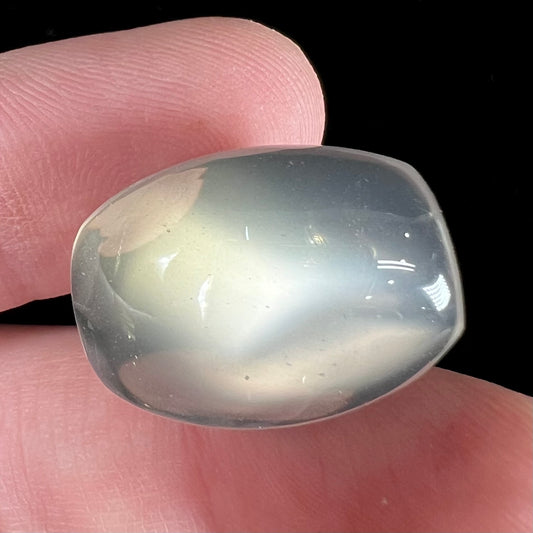 A cushion cut cat's eye moonstone with white adularescence.