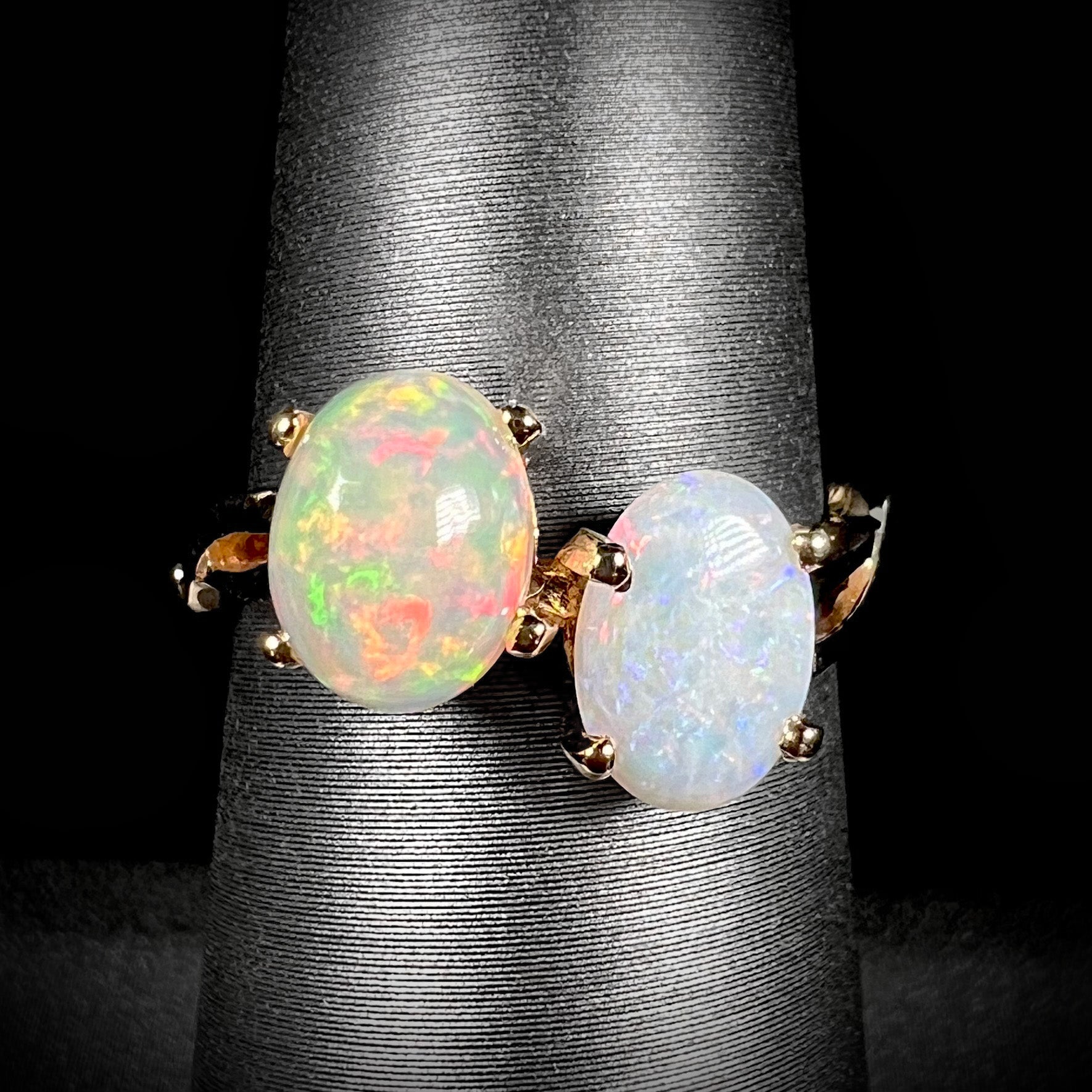 A yellow gold ring mounted with an Ethiopian fire opal and a Coober Pedy, Australian opal.