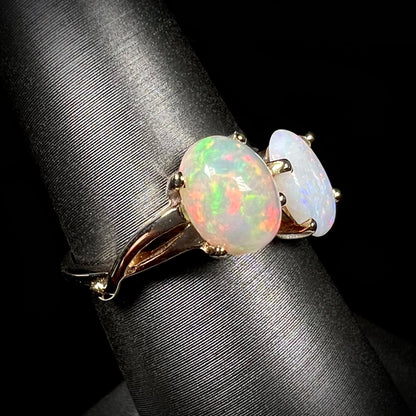 A yellow gold ring mounted with an Ethiopian fire opal and a Coober Pedy, Australian opal.