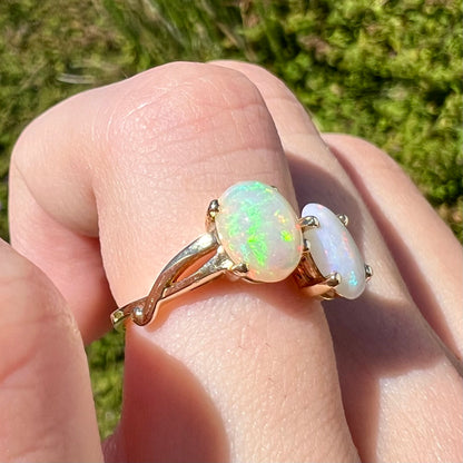 A yellow gold ring mounted with an Ethiopian fire opal and a Coober Pedy, Australian opal.