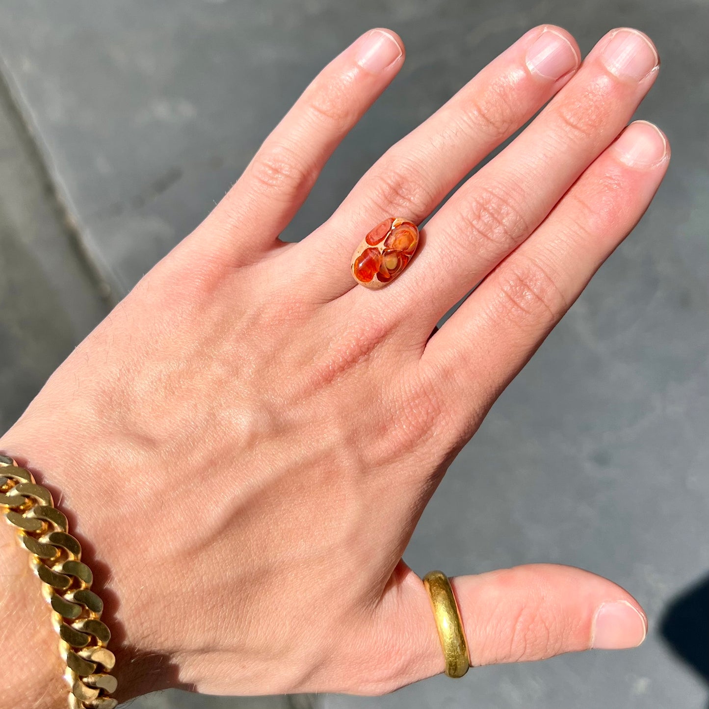 A loose Mexican matrix fire opal stone.  The opal is orange with green flashes.