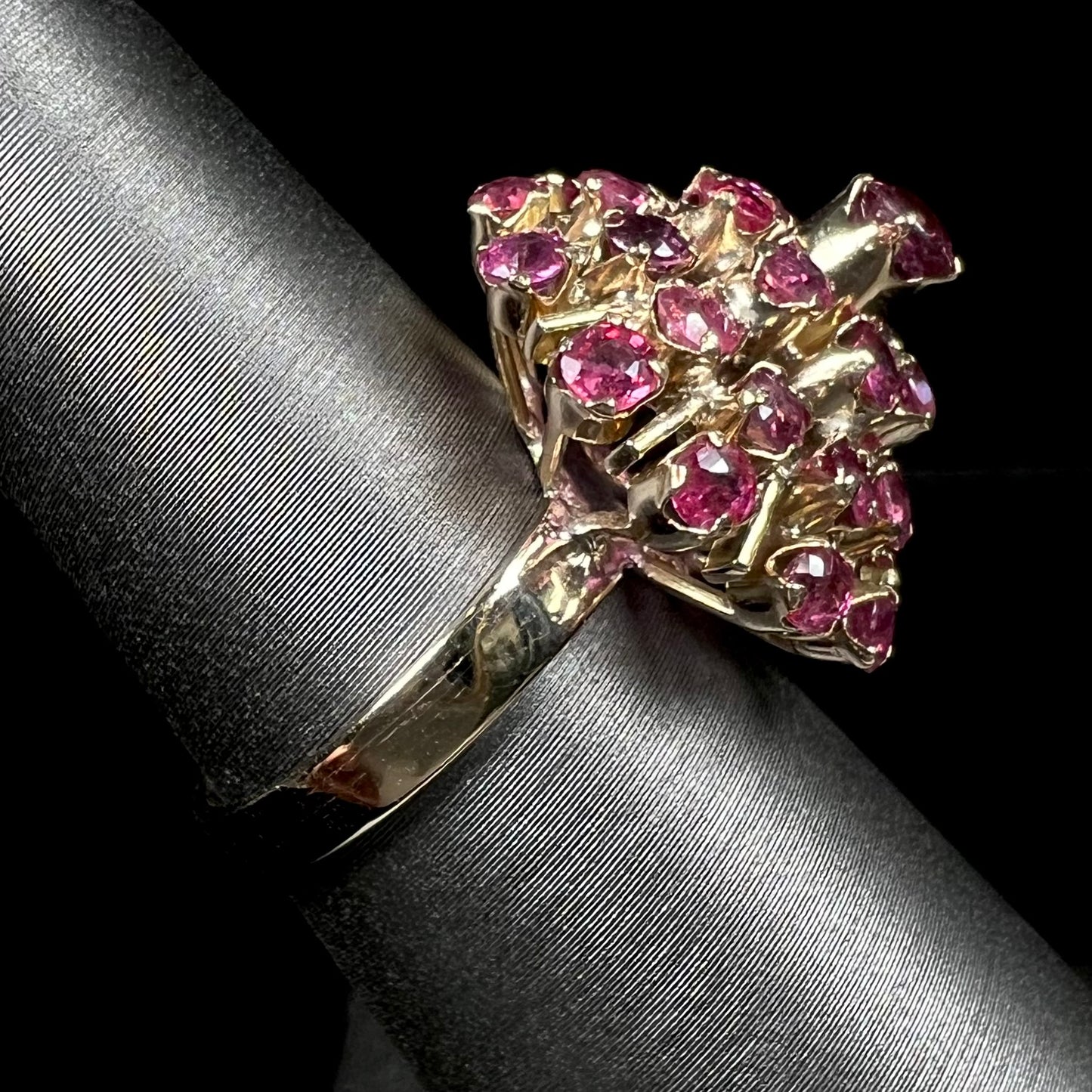 A ladies' vintage Thai princess ring set with round cut purplish red rubies.