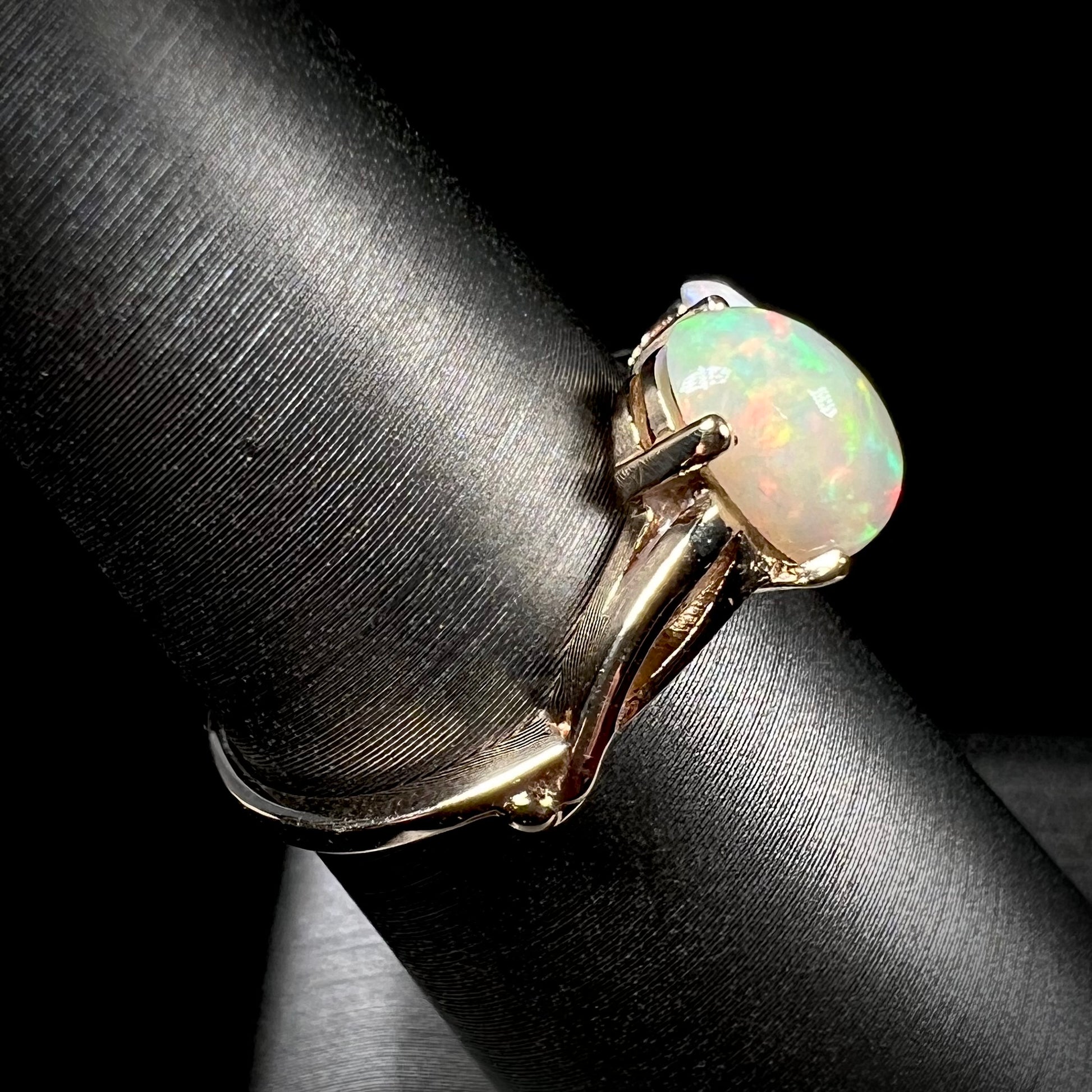 A yellow gold ring mounted with an Ethiopian fire opal and a Coober Pedy, Australian opal.