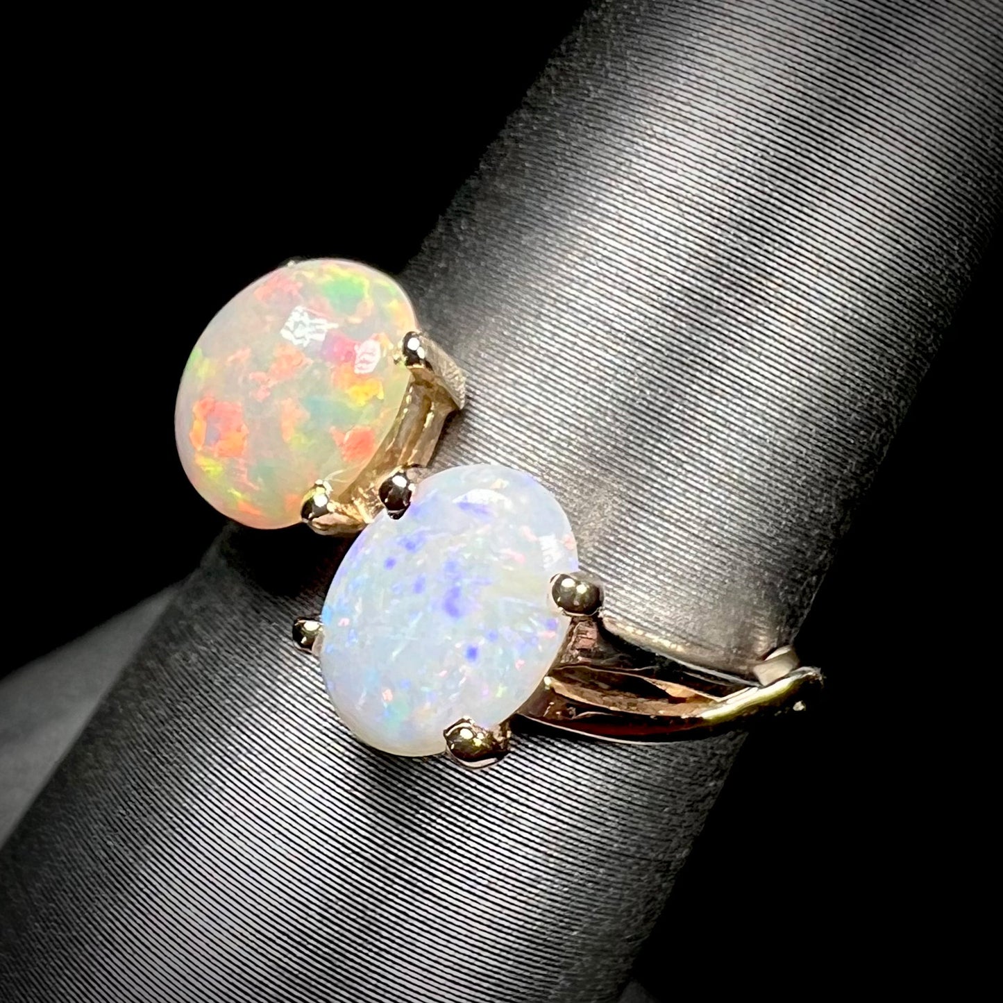 A yellow gold ring mounted with an Ethiopian fire opal and a Coober Pedy, Australian opal.