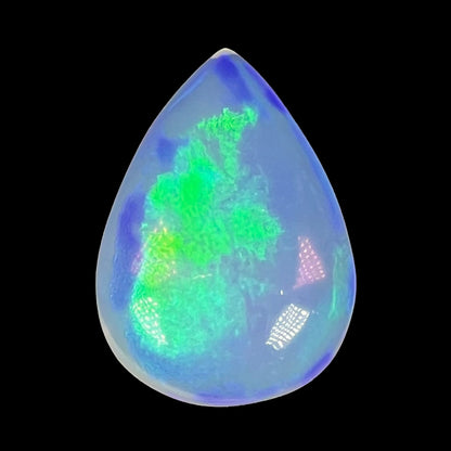 A pear shaped Ethiopian crystal opal stone with green color play.