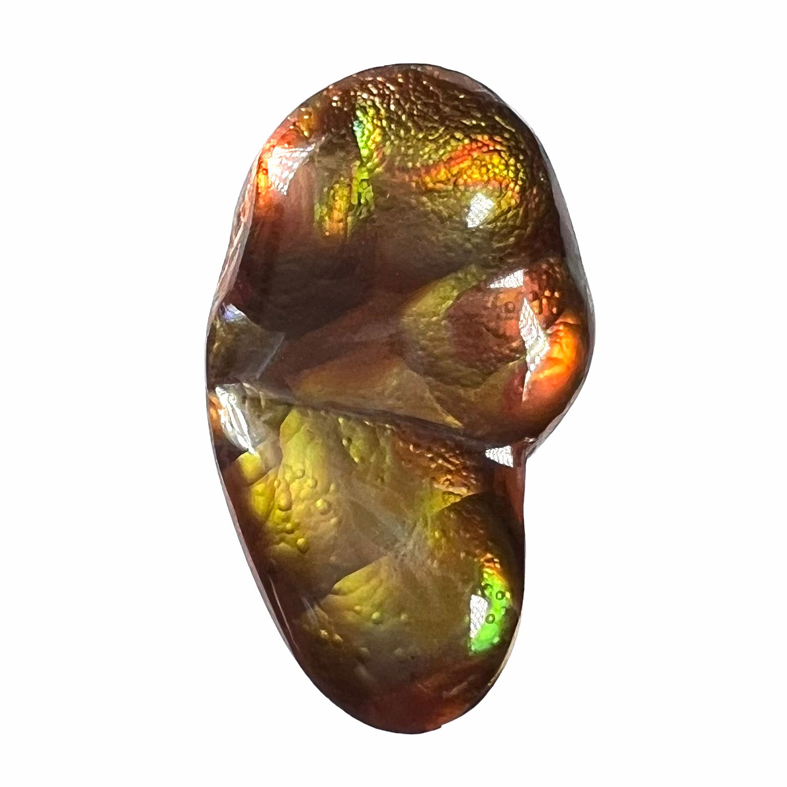 A loose, freeform shaped Mexican fire agate.  The stone has green and orange iridescence.