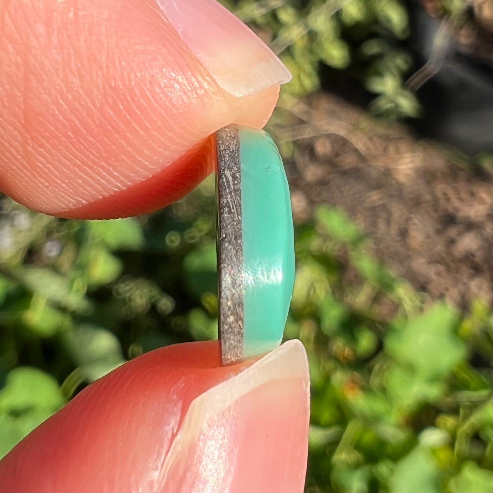 A pear shaped green turquoise stone from Royston Mining District in Nevada.