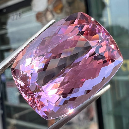 A modified cushion cut Afghanistan kunzite gemstone.  The stone is a purplish pink color and weighs 49.30 carats.