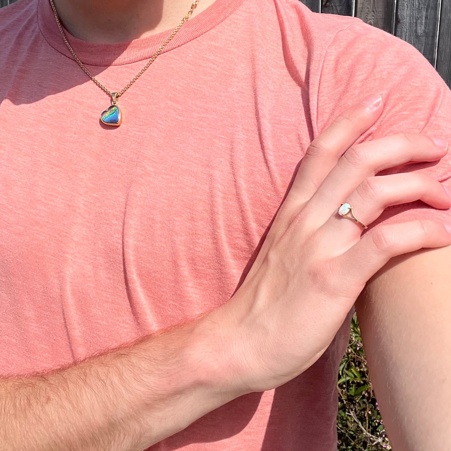 A ladies' simple opal solitaire ring.  The ring is yellow gold with a split shank.