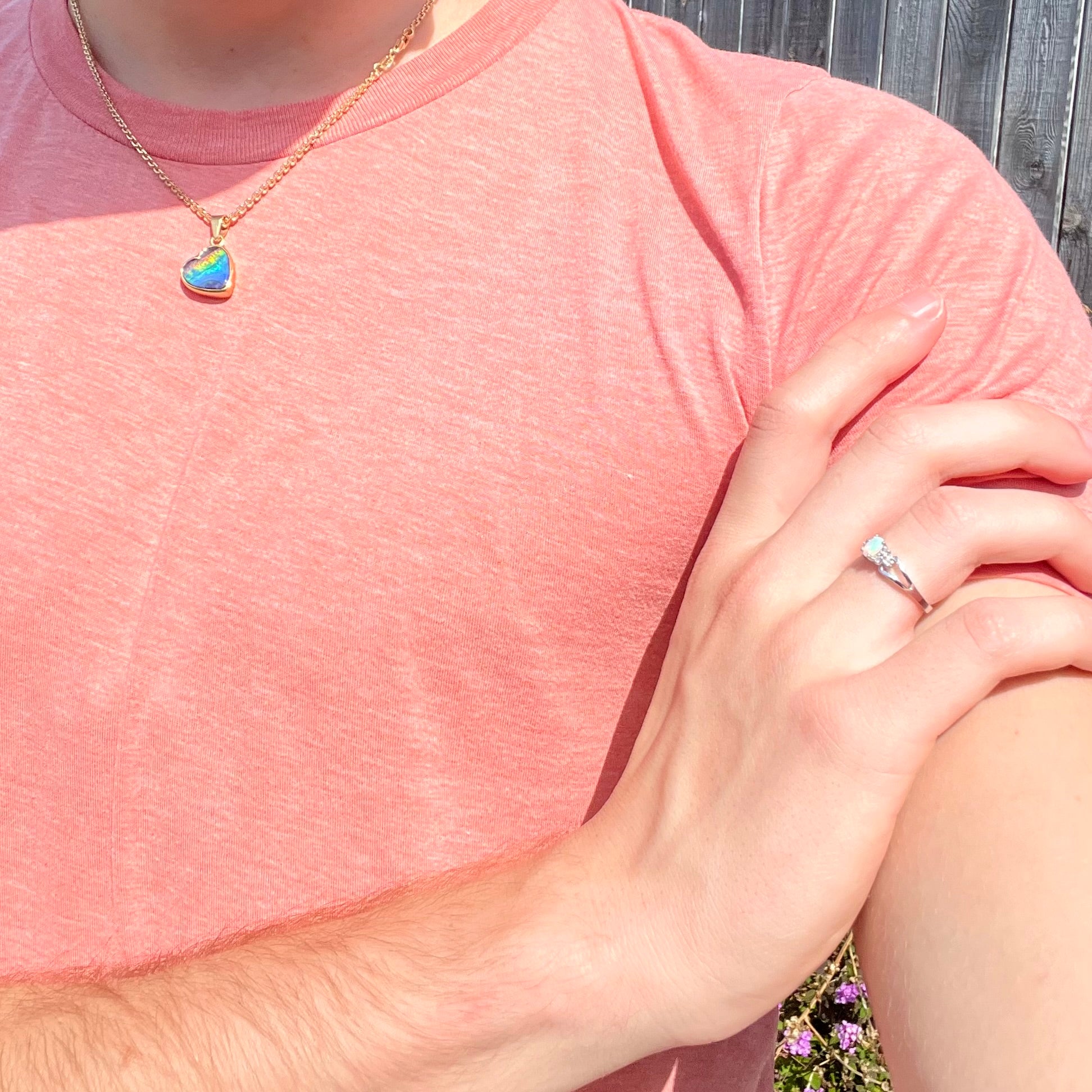 A ladies' white gold opal ring mounted with round diamond accents.