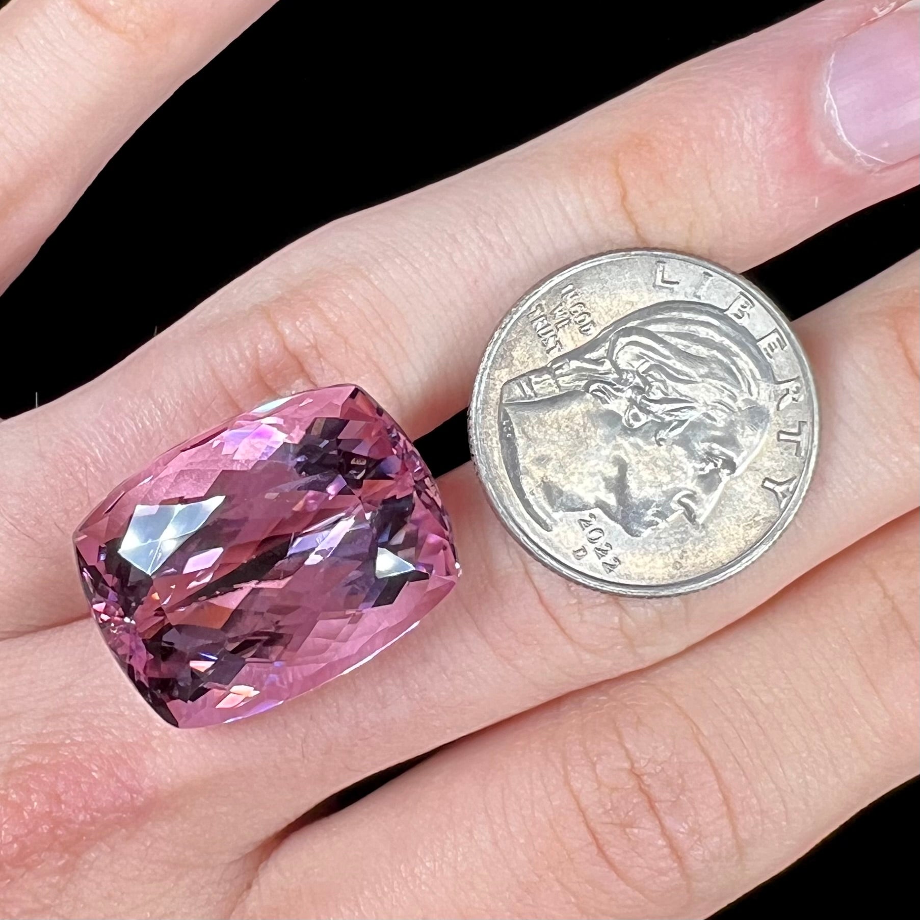 A modified cushion cut Afghanistan kunzite gemstone.  The stone is a purplish pink color and weighs 49.30 carats.