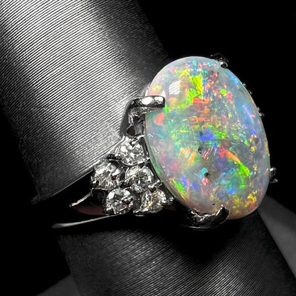 A multicolor Lightning Ridge opal and diamond-accented ring in platinum.