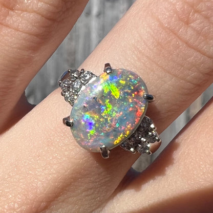 A multicolor Lightning Ridge opal and diamond-accented ring in platinum.