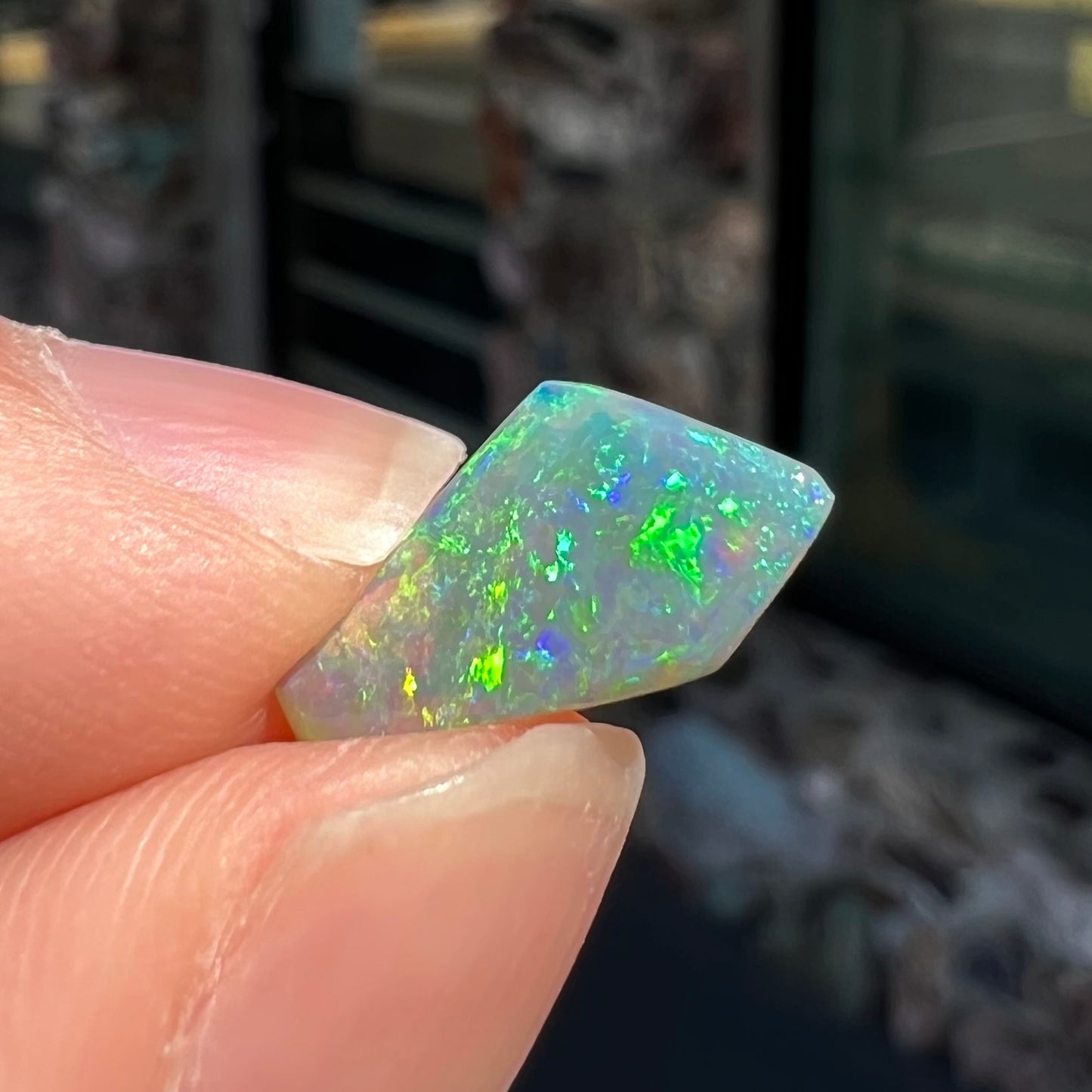 A loose, 1.27 carat Lightning Ridge crystal opal.  The opal has green colors.