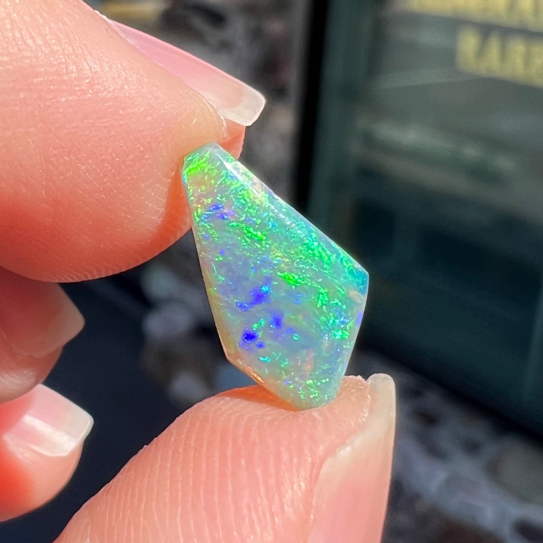 A loose, 1.27 carat Lightning Ridge crystal opal.  The opal has green colors.