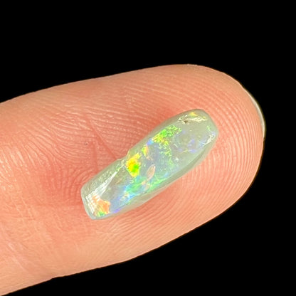 A loose Australian opal stone.  The opal is funky shaped.