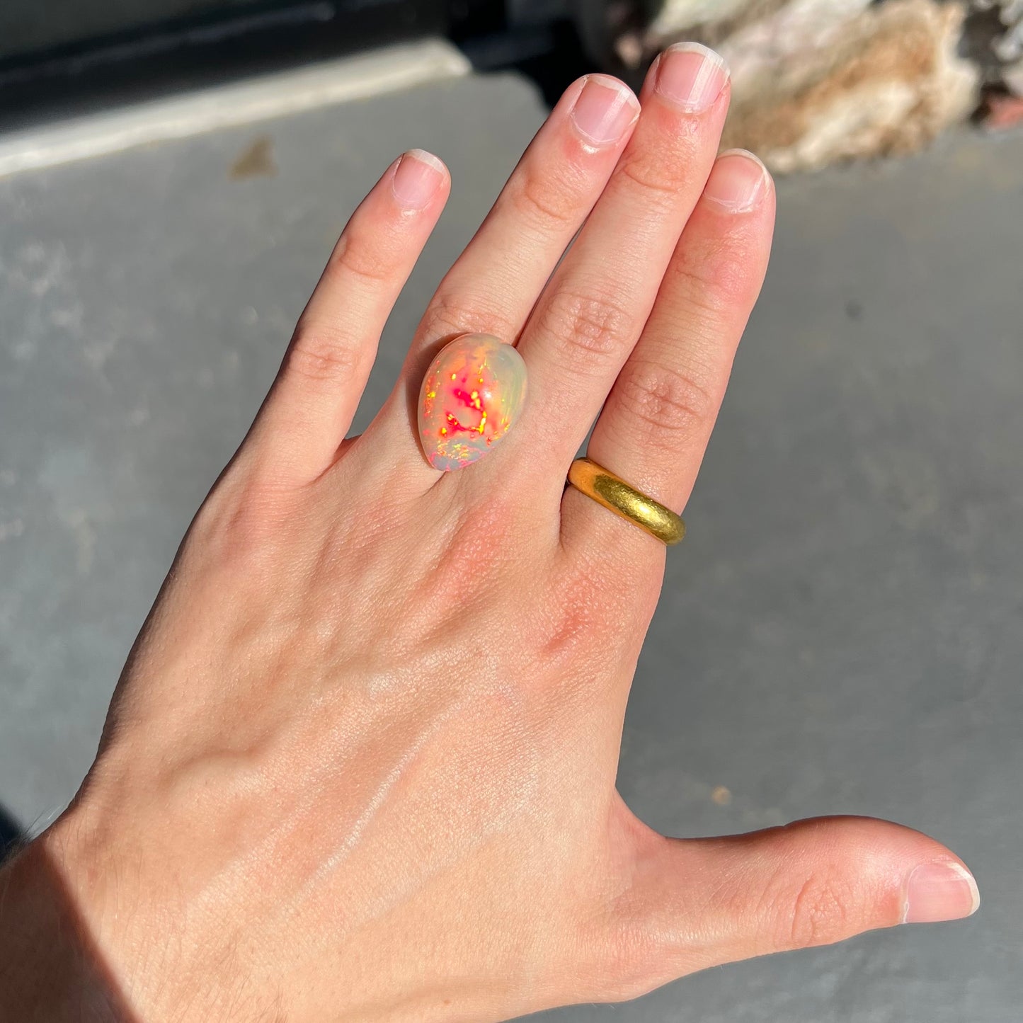 A pear shaped Ethiopian fire opal with vivid red and green play of color.