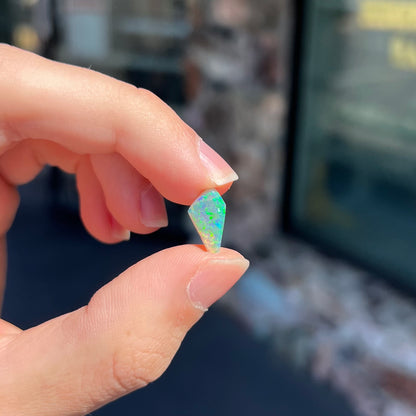 A loose, 1.27 carat Lightning Ridge crystal opal.  The opal has green colors.